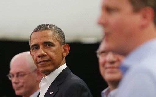 File photo: President Barack Obama with British Prime Minister David Cameron and European Union officials at the G8 Summit June 27, 2013. (Photo by: Andrew Winning/AFP Getty Images).