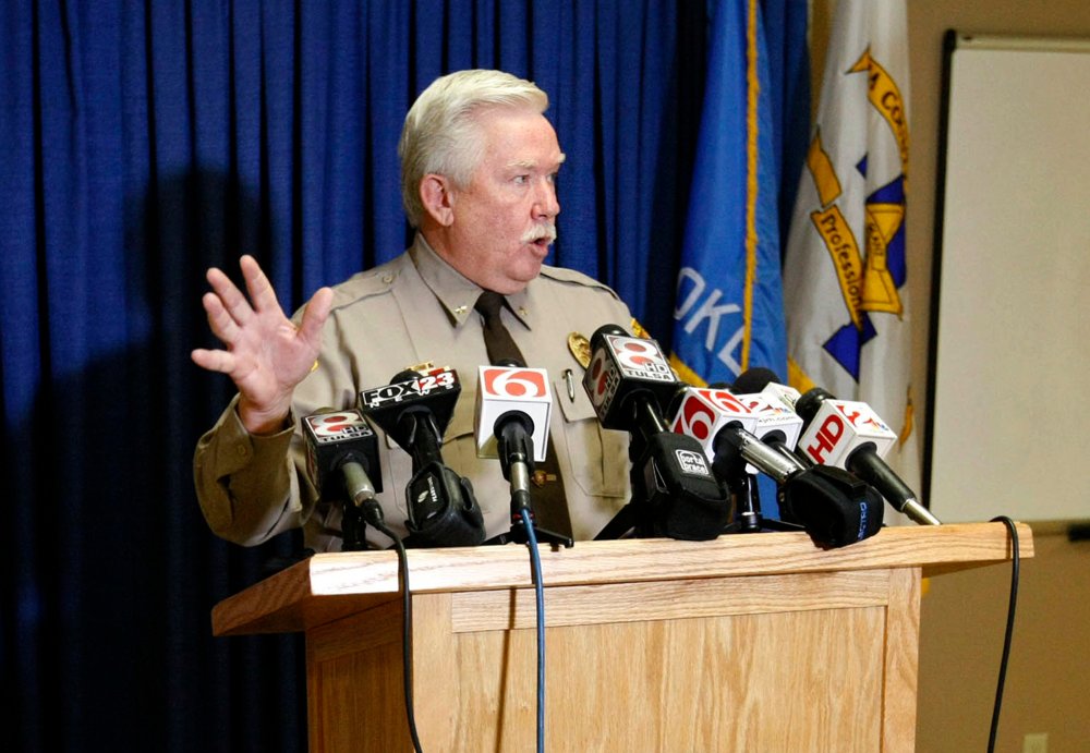 Tulsa County Undersheriff Tim Albin briefs reporters at the agency's headquarters in Tulsa, Okla. in 2014.