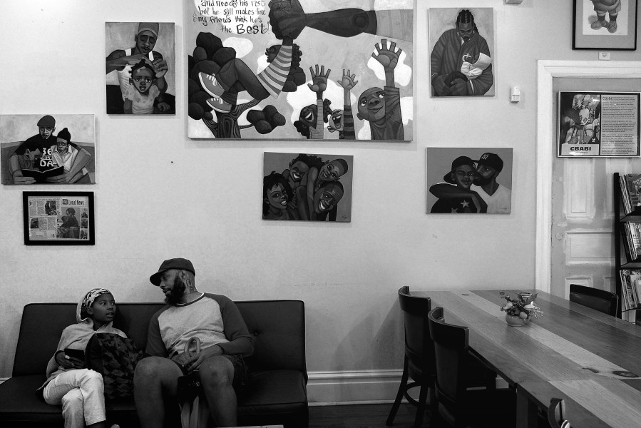 Artist Cbabi Bayoc at his SweetArt Bake Shop with his daughter Jurni. The shop is only a few blocks away from the site of the Oct. 8 Vonderrit Myers shooting.