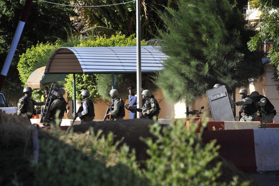 Malian troops take position outside the Radisson Blu hotel in Bamako on Nov. 20, 2015.