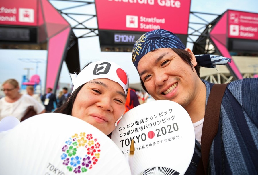 Japanese fans pose outside Olympic Stadium on July 27.