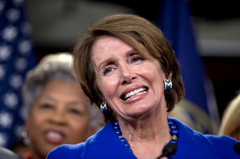 House Minority Leader Nancy Pelosi of Calif., accompanied by House women Democrats, announces that she wants to remain as the top Democrat in the House of Representatives, Wednesday, Nov. 14, 2012, during a news conference on Capitol Hill in Washington...