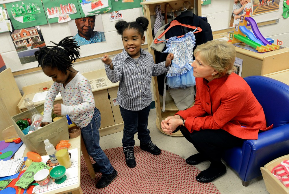 Gov. Bev Perdue, right, listens to Amaya Bryant and Jalynn Brandon, left,  Monday, Dec. 10, 2012, at Primary Colors Early Learning Center in Durham, N.C. Perdue visited the Pre-K classes to highlight the importance of preschool. (AP Photo/The Herald...