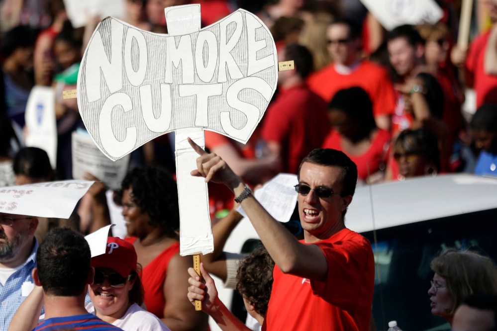 Demonstrates protest outside the school district headquarters, Thursday, May 30, 2013, in Philadelphia.  (AP Photo/Matt Rourke)