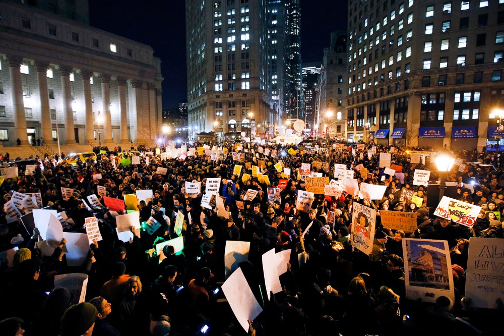 Protesters rally against a grand jury's decision not to indict the police officer involved in the death of Eric Garner in Foley Square, Dec. 4, 2014, in New York, N.Y. (Photo by Jason DeCrow/AP)
