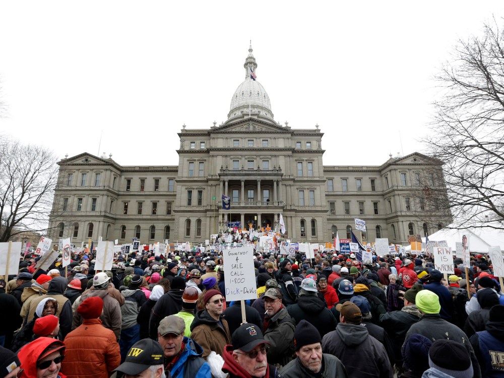 Protesters gather for a rally at the State Capitol in Lansing, Mich., Tuesday, Dec. 11, 2012. The crowd is protesting right-to-work legislation passed last week. Michigan could become the 24th state with a right-to-work law next week. Rules required a...