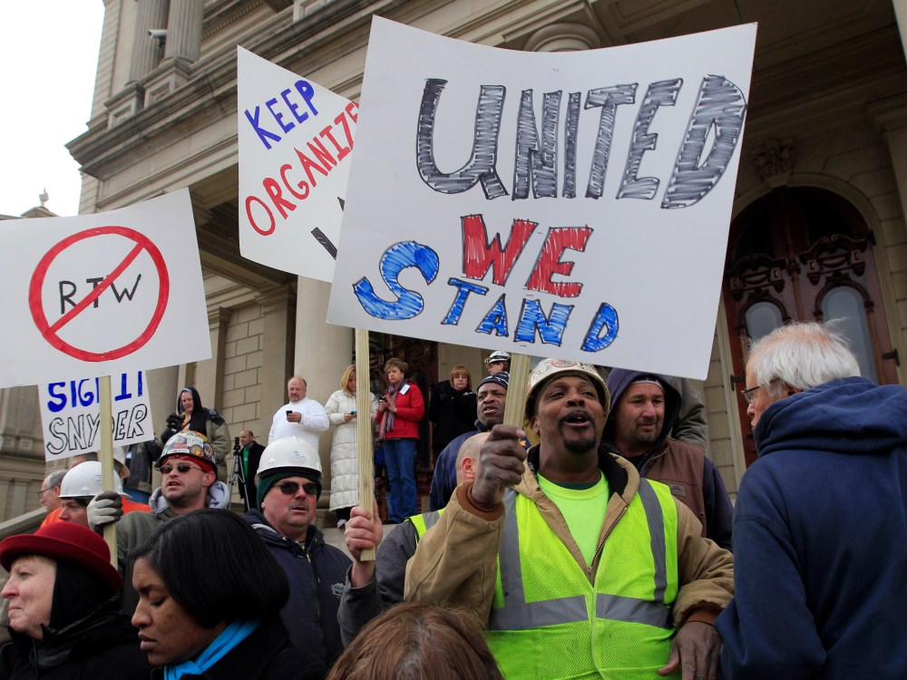 Union workers rally outside the Capitol in Lansing, Mich., Thursday, Dec. 6, 2012 as Senate Republicans introduced right-to-work legislation in the waning days of the legislative session. The outnumbered Democrats pledged to resist the proposal and...