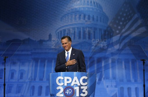 Former Republican Presidential candidate Mitt Romney puts his hand to his heart as supporters cheer him upon taking the stage to speak at the Conservative Political Action Conference (CPAC) at National Harbor, Maryland March 15, 2013.  REUTERS/Kevin...