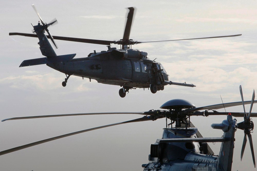 A HH-60 Pave Hawk helicopter of the U.S. 56th RQS (rescue squadron) is seen in flight in Cazaux, southwestern France, Jan. 13, 2010. (Photo by Regis Duvignau/Reuters)