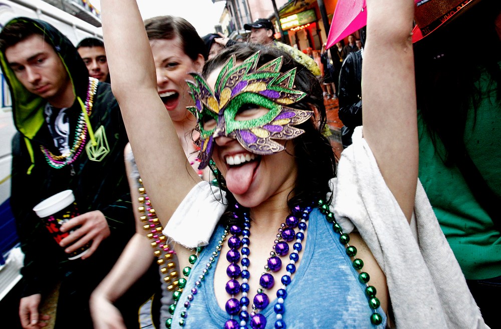 Revelers celebrate Mardi Gras on the streets of the French Quarter in New Orleans on March 5, 2011.