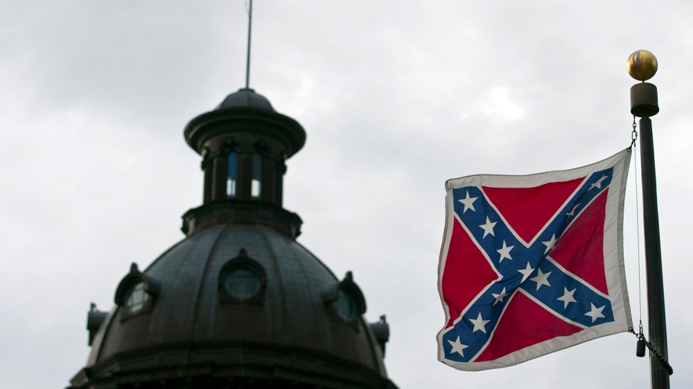 A Confederate flag flies outside the South Carolina State House in Columbia, S.C., Jan. 17, 2012. (Photo by Chris Keane/Reuters)