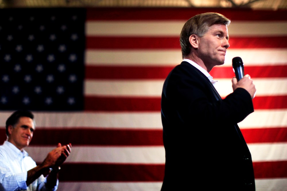 Mitt Romney applauds his endorsement from Virginia Governor Bob McDonnell during a campaign rally in North Charleston, South Carolina, Jan. 20, 2012.