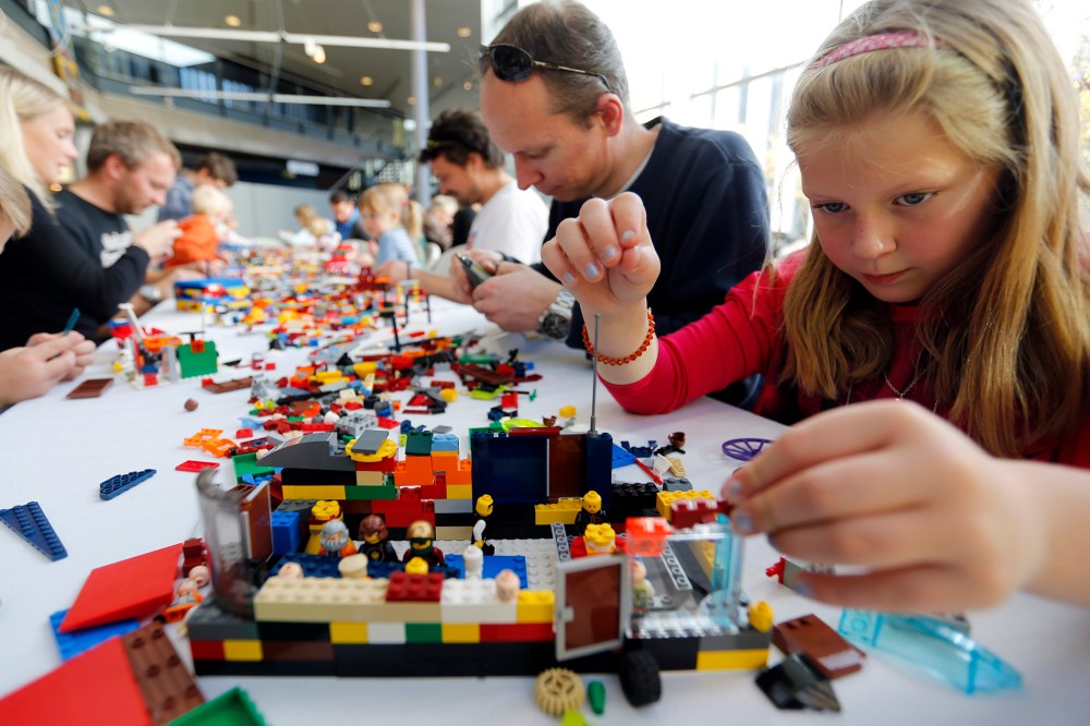 Haga, her father Trond and her brother Henrik attend the annual Lego Festival, where the theme is building your dream city, at the Technical Museum in Oslo
