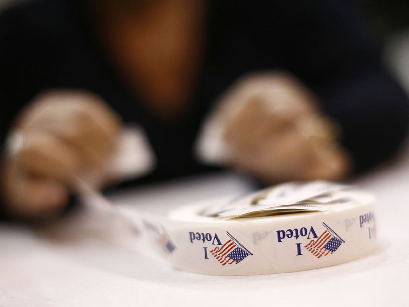 A poll worker prepares 'I Voted' stickers at Harrison United Methodist Church during the U.S. presidential election in Pineville, North Carolina November 6, 2012. (Photo by Chris Keane/Reuters)