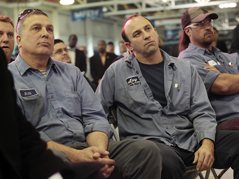 Chrysler Mack I Engine Plant assembly workers Bill Galecki (L), Tony Russo and John Terry (R) listen during a news conference to announce a major financial investment and more jobs added to the engine plant in Detroit, Michigan November 15, 2012. ...