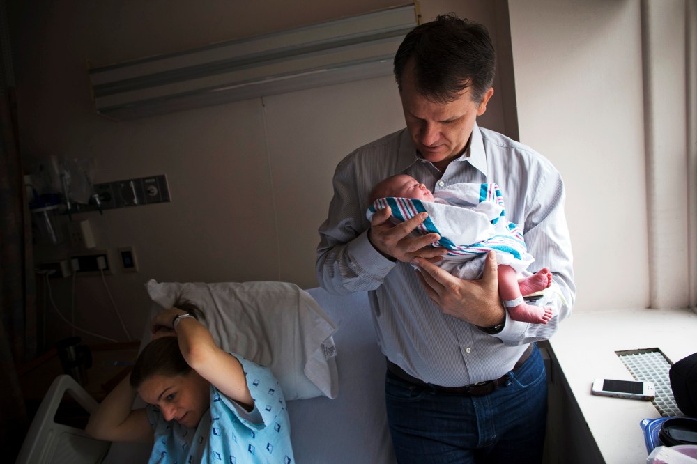 Dale Smith holds his newborn baby at the New York Downtown Hospital, Dec.12, 2012.