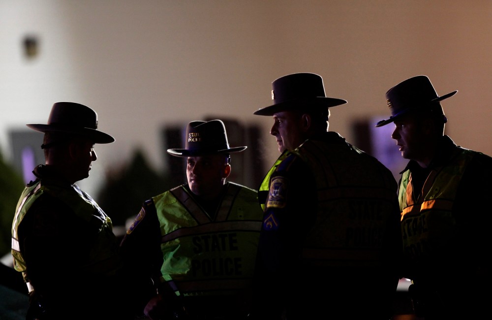 A Connecticut State Police Officers stand outside the Sandy Hook Volunteer Fire and Rescue Company near Sandy Hook Elementary School in Newtown, Connecticut Dec. 14, 2012.