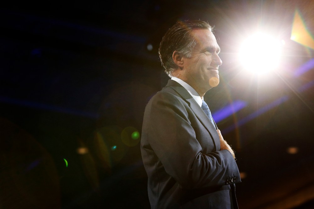 Mitt Romney acknowledges an ovation as he takes the stage for remarks during CPAC in National Harbor, Maryland, March 15, 2013.