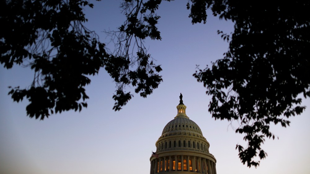 Night falls over the U.S. Capitol.