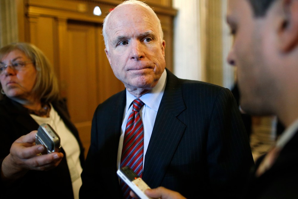 U.S. Senator John McCain (R-Ariz.) takes questions from reporters after the weekly Republican caucus luncheon at the U.S. Capitol in Washington March 11, 2014.