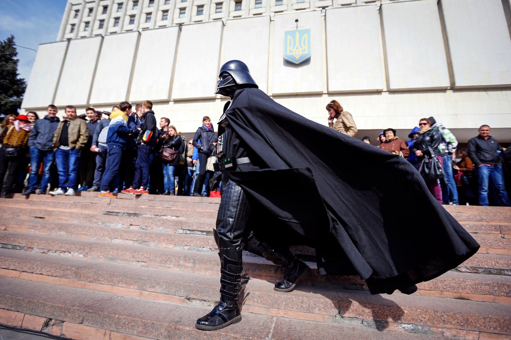 "Darth Vader", the leader of the Internet Party of Ukraine, walks during a rally in front of the Ukrainian Central Elections Commission in Kiev April 3, 2014. (Photo by Shamil Zhumatov/Reuters)