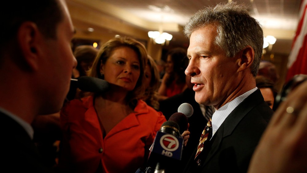 Republican Scott Brown talks to the media after announcing his bid for the United States Senate primary election in Portsmouth, New Hampshire, April 10, 2014.