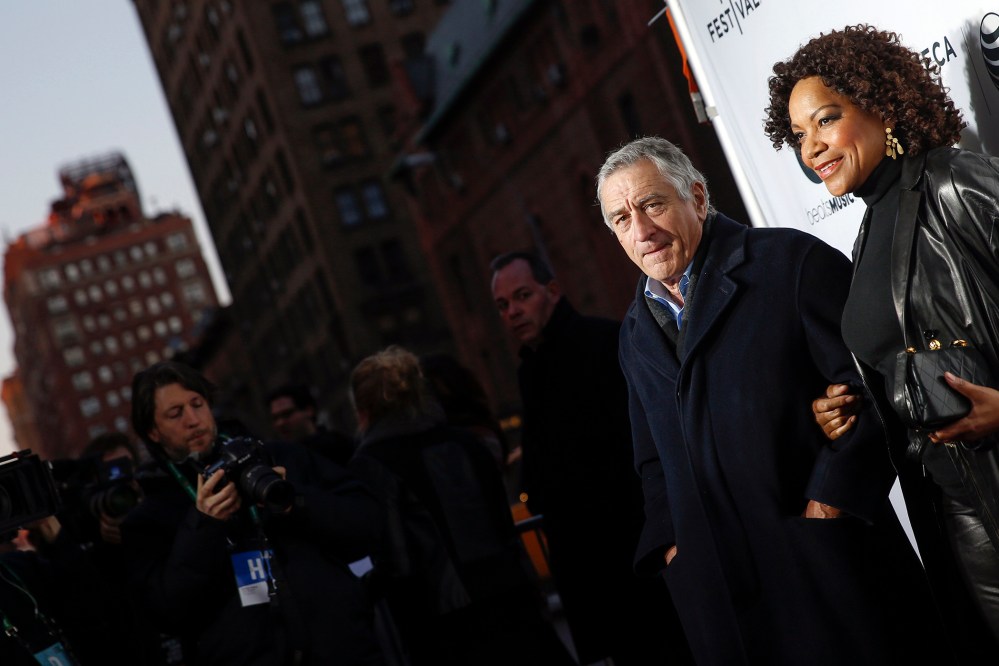 Robert De Niro stands with his wife Grace Hightower upon arriving for the 2014 Tribeca Film Festival opening night screening of 'Time Is Illmatic' in New York, April 16, 2014. (Photo by Shannon Stapleton/Reuters)