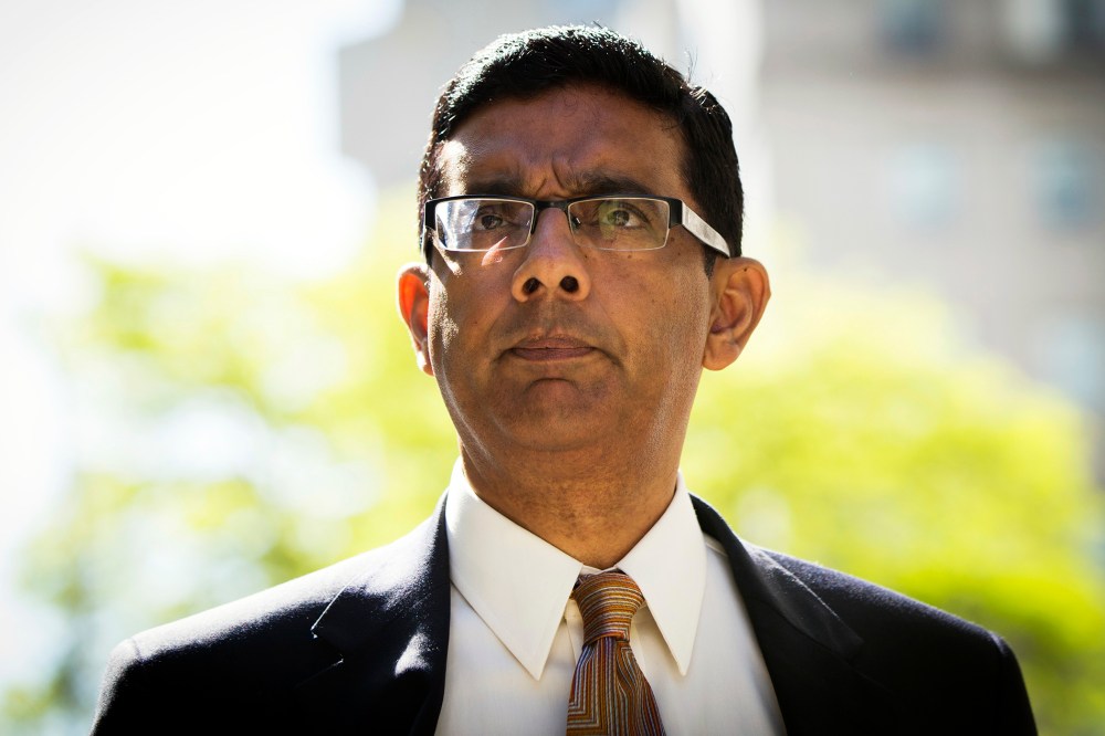 Conservative commentator and best-selling author, Dinesh D'Souza exits the Manhattan Federal Courthouse after pleading guilty in New York on May 20, 2014. (Photo by Lucas Jackson/Reuters)