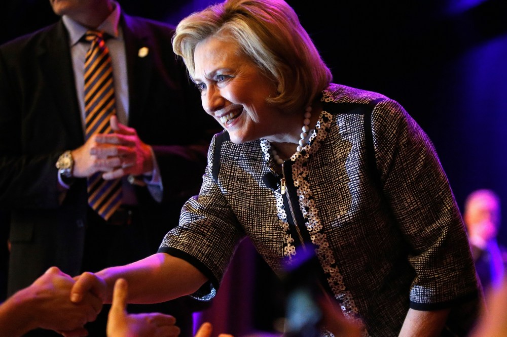 Former U.S. Secretary of State Hillary Clinton greets supporters at George Washington University in Washington on June 13, 2014.