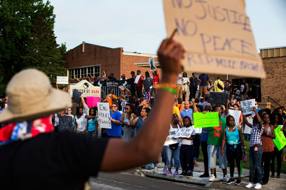 Demonstrators protest outside of Greater St. Marks Family Church in Ferguson, Missouri