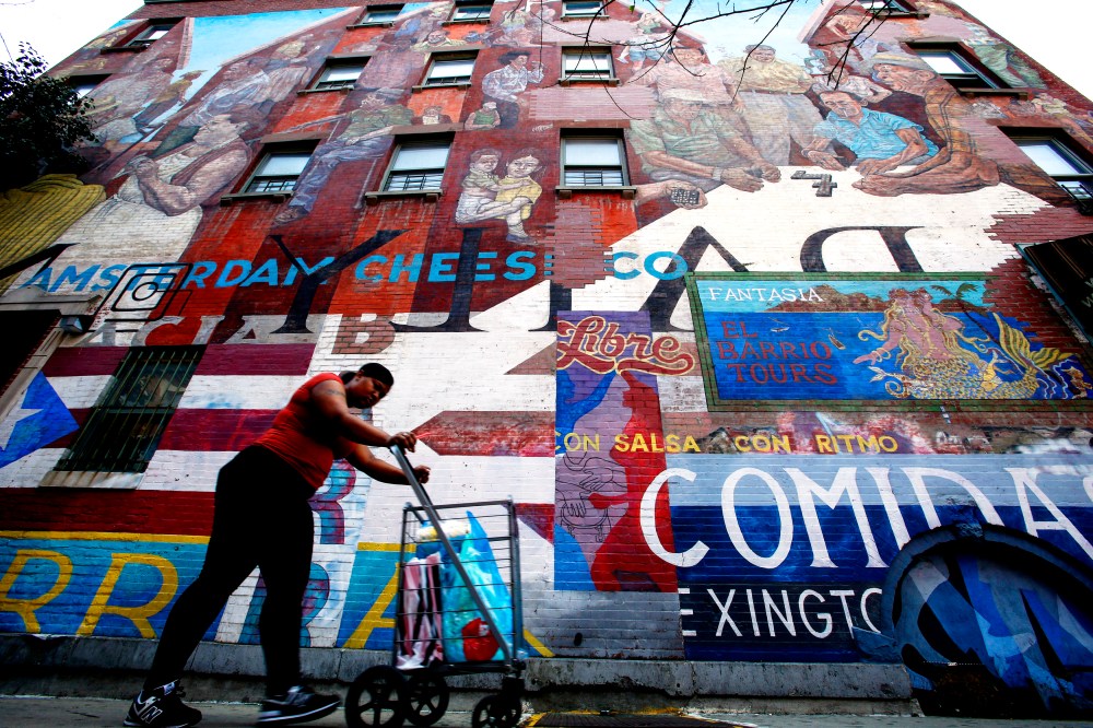 "The Spirit of East Harlem" mural in "EL BARRIO," Harlem, New York Aug. 10, 2014. A bubbling Hispanic cultural stew is brewing in New York, spiced by Latin American newcomers. (Photo by Eduardo Munoz/Reuters)
