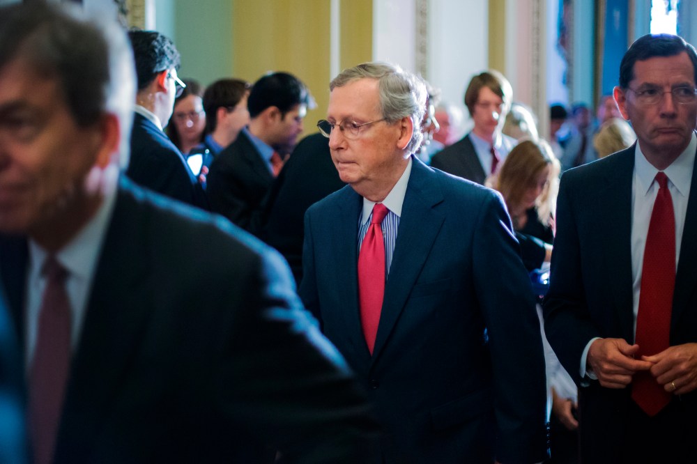 McConnell departs after his news conference following the weekly Republican caucus luncheon at the U.S. Capitol in Washington