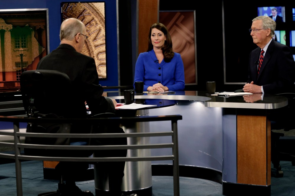 Republican U.S. Senate Minority Leader Mitch McConnell (R) and Democratic U.S. Senate candidate Alison Lundergan Grimes (L) prepare for their debate at the Kentucky Education Television network headquarters in Lexington, Ky on Oct. 13, 2014.