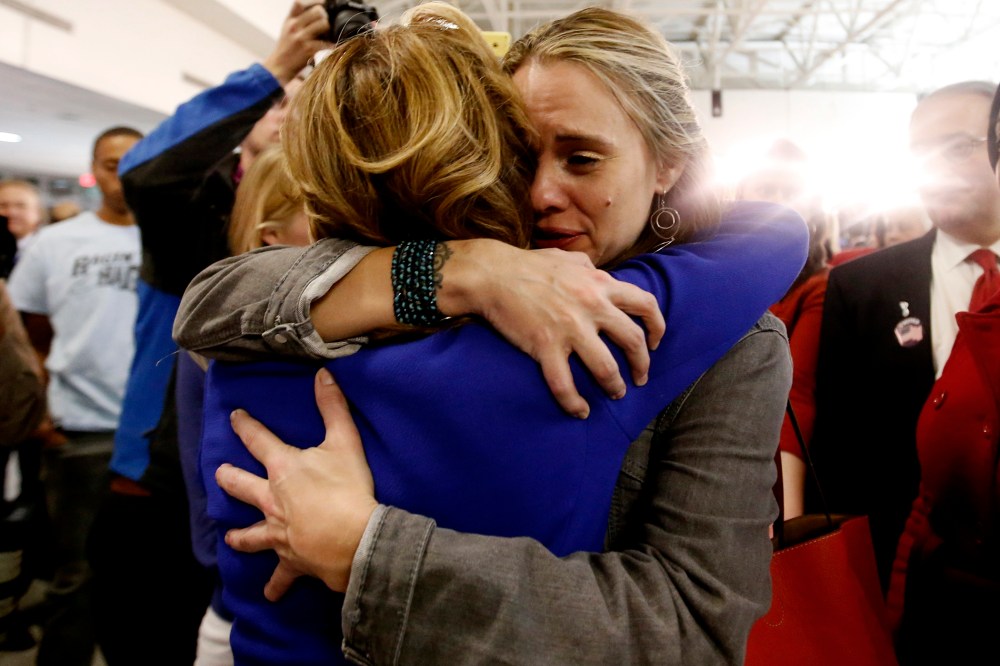 Democratic U.S. Senator Kay Hagan (L) of North Carolina is hugged by a supporter after her concession speech acknowledging her defeat by challenger Thom Tillis at her midterm election night rally in Greensboro, North Carolina on Nov. 4, 2014.