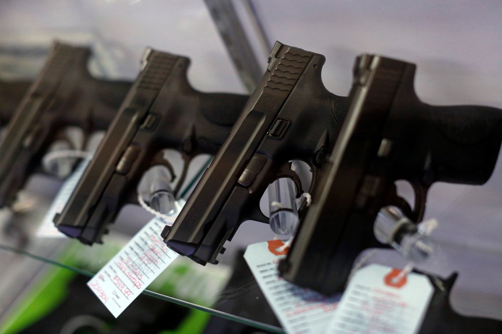 Handguns are seen for sale in a display case. (Photo by Jim Young/Reuters)