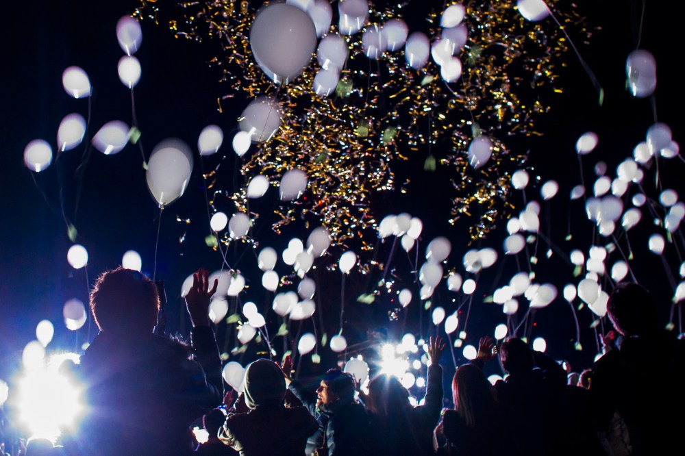 People release balloons during New Year celebrations in Tokyo
