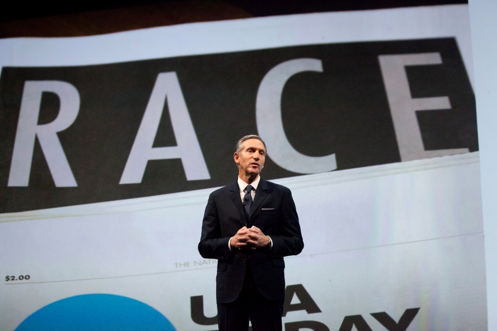 Starbucks Corp Chief Executive Howard Schultz, pictured with images from the company's new "Race Together" project behind him, speaks during the company's annual shareholder's meeting in Seattle, Washington March 18, 2015. (Photo by David Ryder/Reuters)