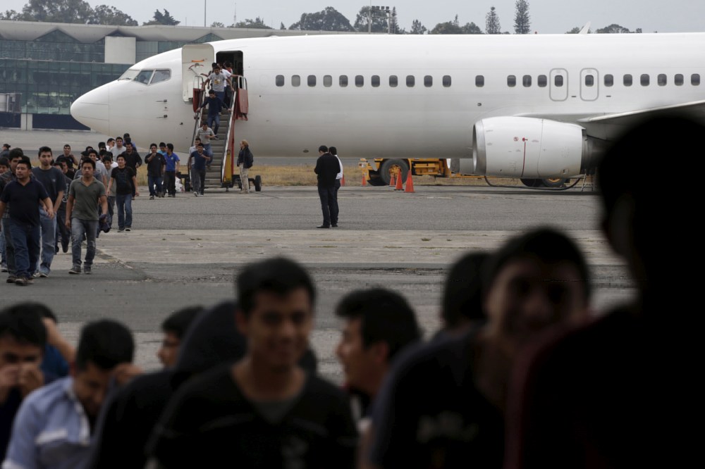 Illegal migrants from Guatemala, deported from the US, arrive at an air force base, Guatemala City, March 19, 2015. The flight carrying some 150 illegal migrants was part of a five day operation that deported thousands. (Photo by Jorge Dan Lopez/Reuters)