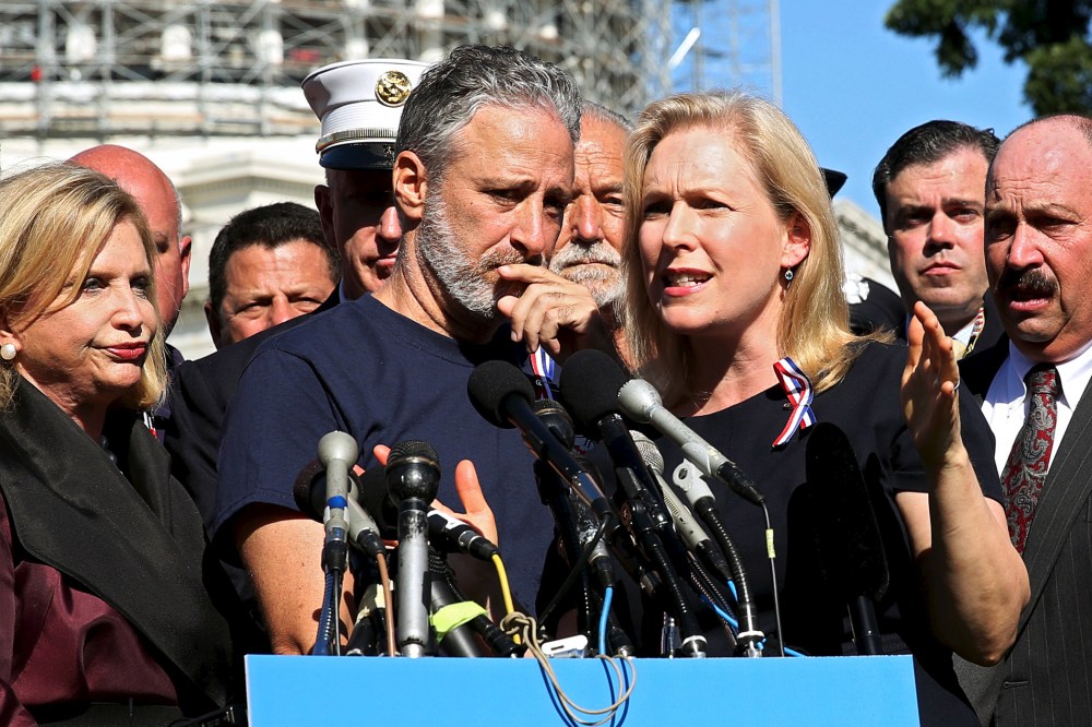 Comedian Jon Stewart listens to Senator Kirsten Gillibrand (D-NY) at an event to urge U.S. lawmakers to re-authorize the Zadroga Bill at the U.S. Capitol in Washington, Sept. 16, 2015. (Photo by Gary Cameron/Reuters)