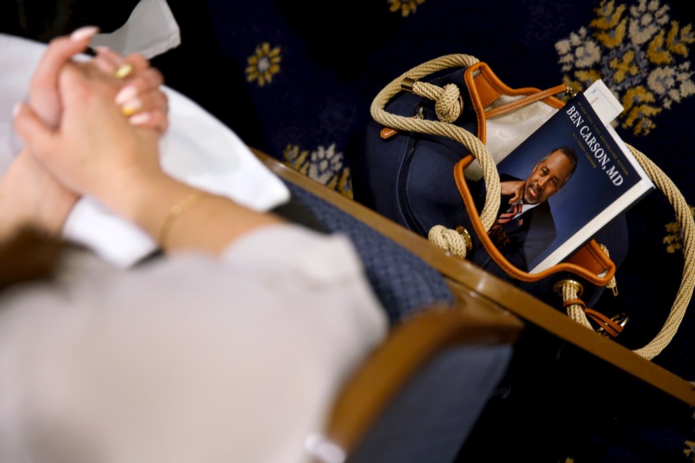 An audience member keeps a copy of U.S. Republican candidate Dr. Ben Carson's book as he speaks at the National Press Club in Washington, Oct. 9, 2015. (Photo by Jonathan Ernst/Reuters)
