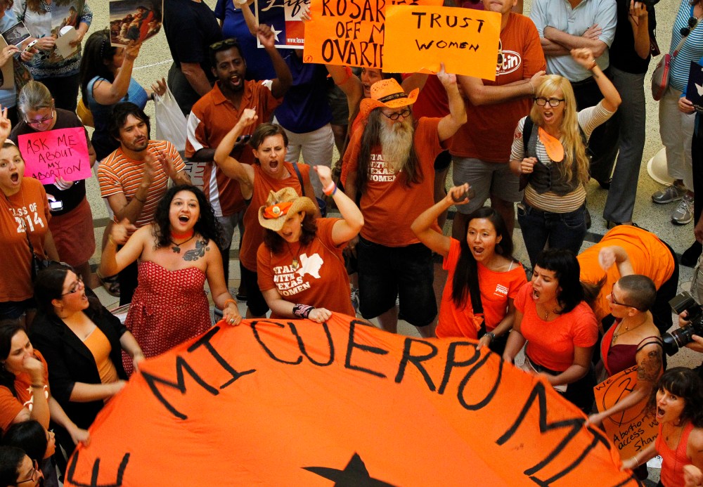 Protesters rally in the rotunda of the State Capitol as the state Senate meets to consider legislation restricting abortion rights in Austin, July 12, 2013.