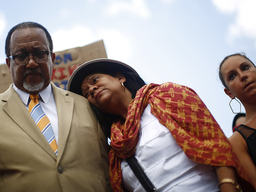 People attend a rally in reaction to a not guilty verdict for George Zimmerman in New York July 14, 2013. (Photo by Eric Thayer/Reuters)