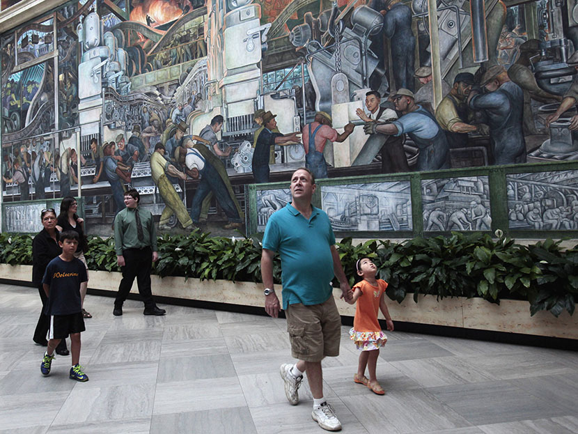 Visitors at the Detroit Institute of Arts museum look at the work by famed muralist Diego Rivera in Detroit, Michigan June 2, 2013. (Photo by Rebecca Cook/Reuters)