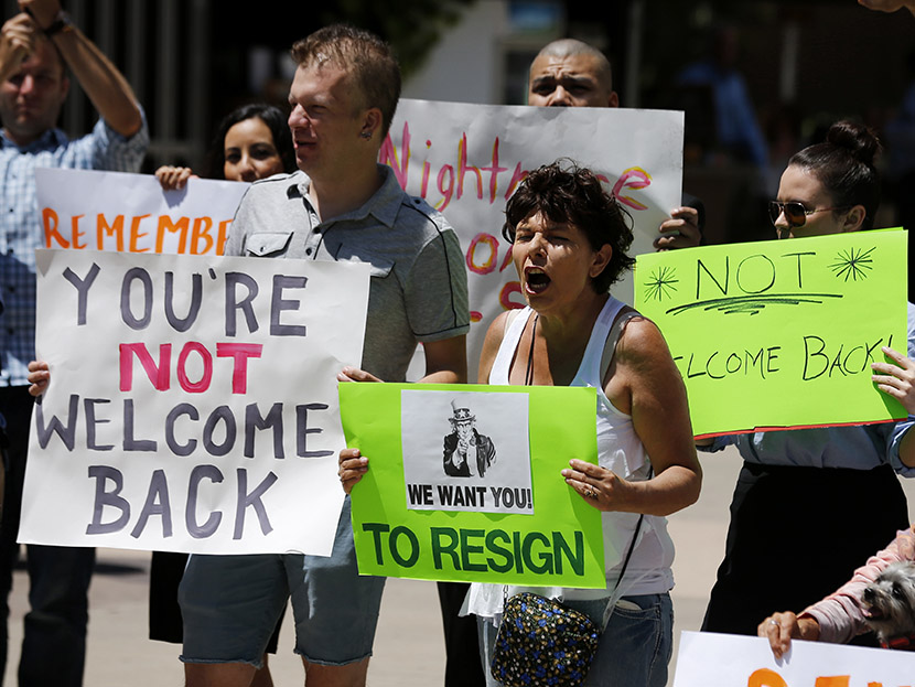 Opponents of San Diego Mayor Filner attend a "Not Welcome Back'' rally in San Diego