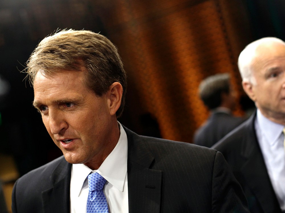U.S. Senator Jeff Flake (R-AZ) (L) and U.S. Senator John McCain (R-AZ) speak to reporters after attending a "Conversation On Immigration" during a town hall event in Mesa