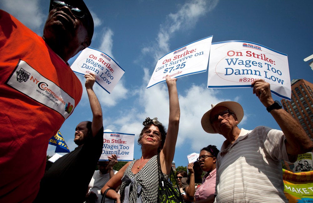 Mira Furman (C) joins with fast food workers to protest the minimum wage in New York on Aug. 29, 2013.
