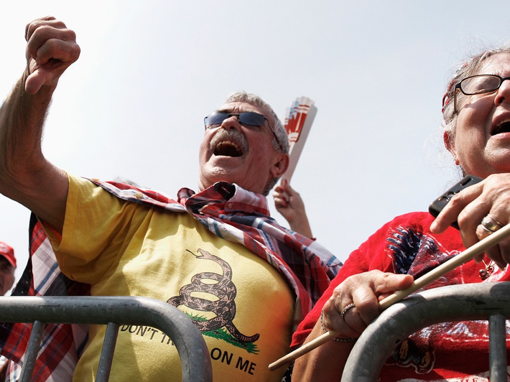 A man gives a thumbs-down to Obamacare at the Tea Party Patriots 'Exempt America from Obamacare' rally on the west lawn of the U.S. Capitol in Washington