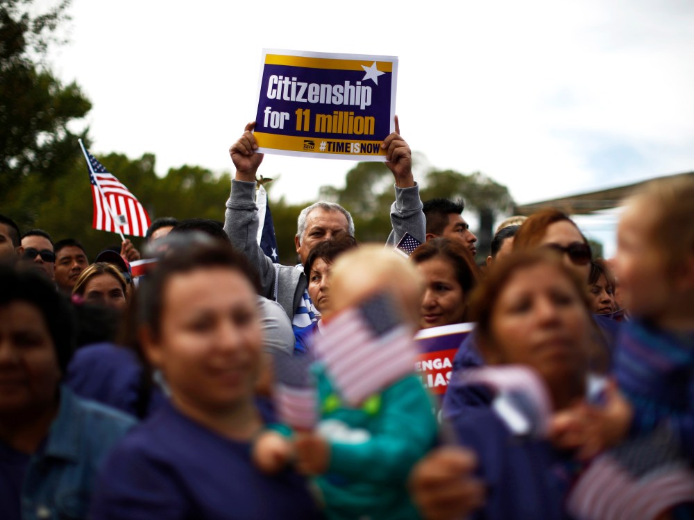 Hundreds of protesters calling for comprehensive immigration reform gather at a rally on the Washington Mall, October 8, 2013.