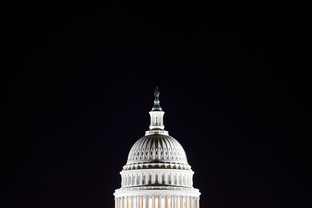 The U.S. Capitol dome in the pre-dawn darkness in Washington D.C.