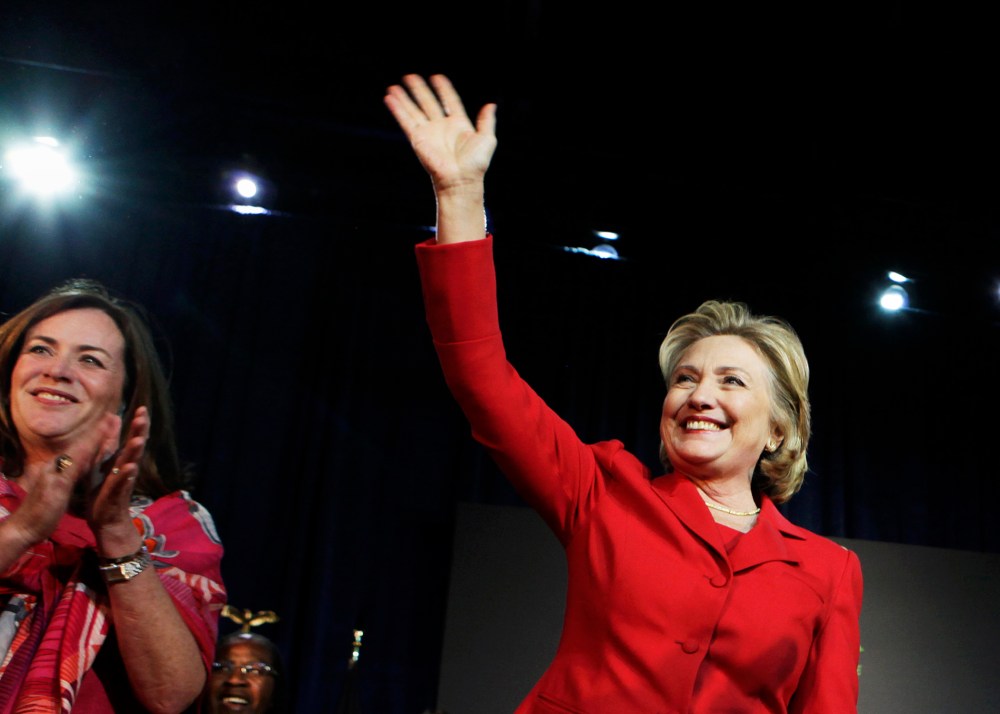 Former U.S. Secretary of State Hillary Clinton waves to the audience at an event in Falls Church, Va. on Oct. 19, 2013. (Photo by Yuri Gripas/Reuters)